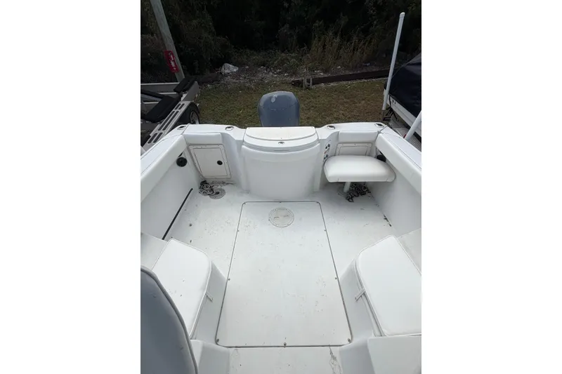 Slide: The Image of 2002 Seaswirl 2101 boat interior with seating and storage compartments. - 7