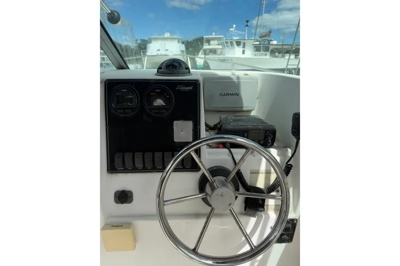 Slide: The Image of Steering console of a 2002 Seaswirl 2101 boat with Garmin navigation system. - 8