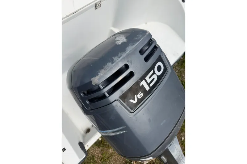 Slide: The Image of Outboard motor labeled "V6 150" on a 2002 Seaswirl 2101 boat. - 16