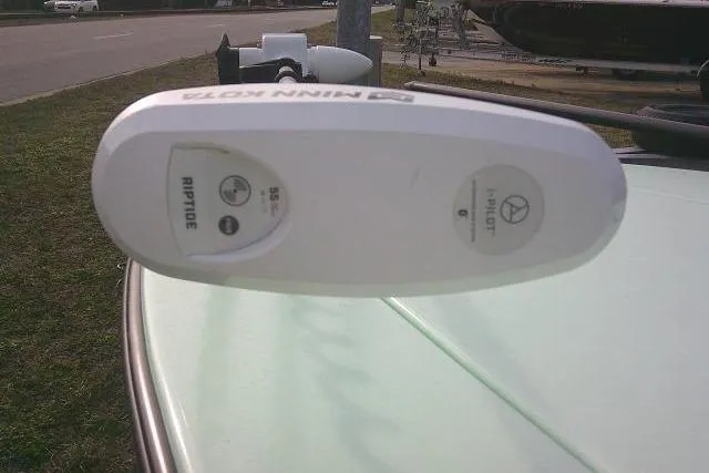 Slide: The Image of 2020 Skimmer Skiff 14 SKIFF with Riptide motor, parked on grass. - 5
