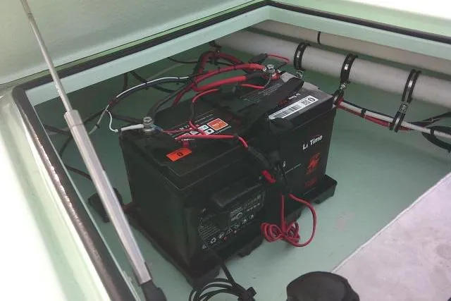 Slide: The Image of Battery compartment of 2020 Skimmer Skiff 14 SKIFF with wiring and hydraulic support. - 9