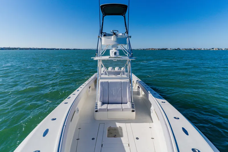 Slide: The Image of 2012 SeaVee 390B boat on open water, clear blue sky, and calm sea. - 12