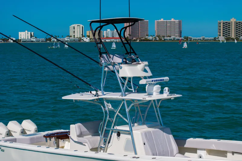 Slide: The Image of 2012 SeaVee 390B boat on water with city skyline in background. - 22