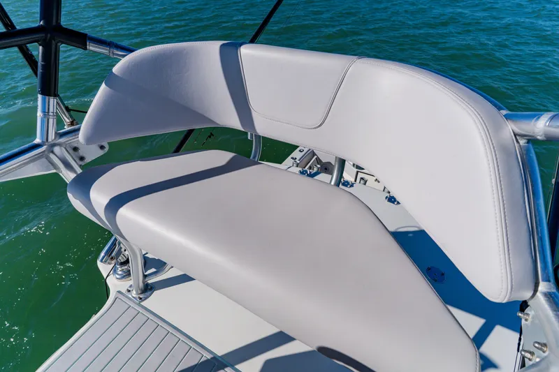 Slide: The Image of 2012 SeaVee 390B boat seat with sleek design on calm water. - 25