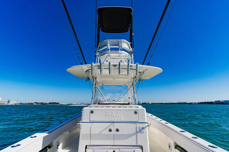 Slide: The Image of 2012 SeaVee 390B boat on open water under clear blue sky. - 29