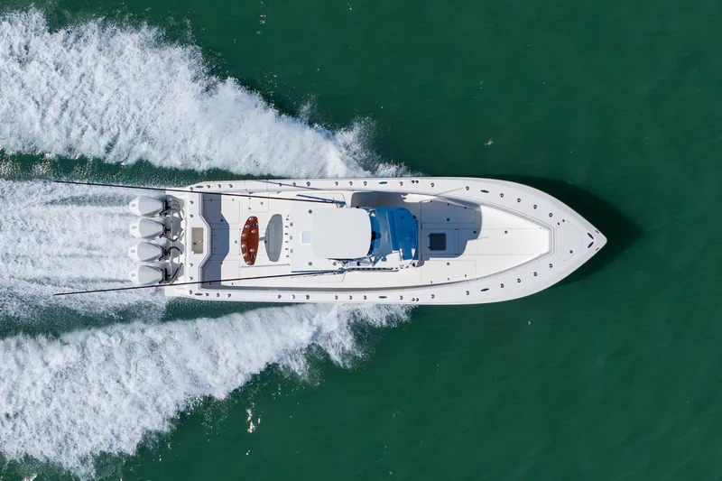 Slide: The Image of Aerial view of 2012 SeaVee 390B boat cruising on turquoise water. - 3