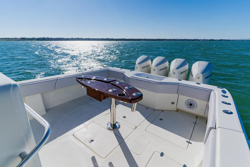 Slide: The Image of 2012 SeaVee 390B boat deck with multiple outboard engines on a sunny day. - 33