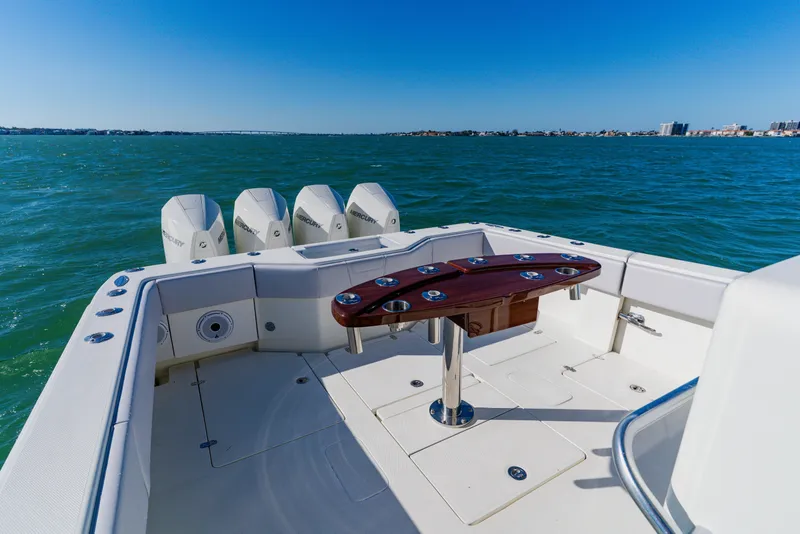 Slide: The Image of 2012 SeaVee 390B boat with four outboard engines on open water. - 34