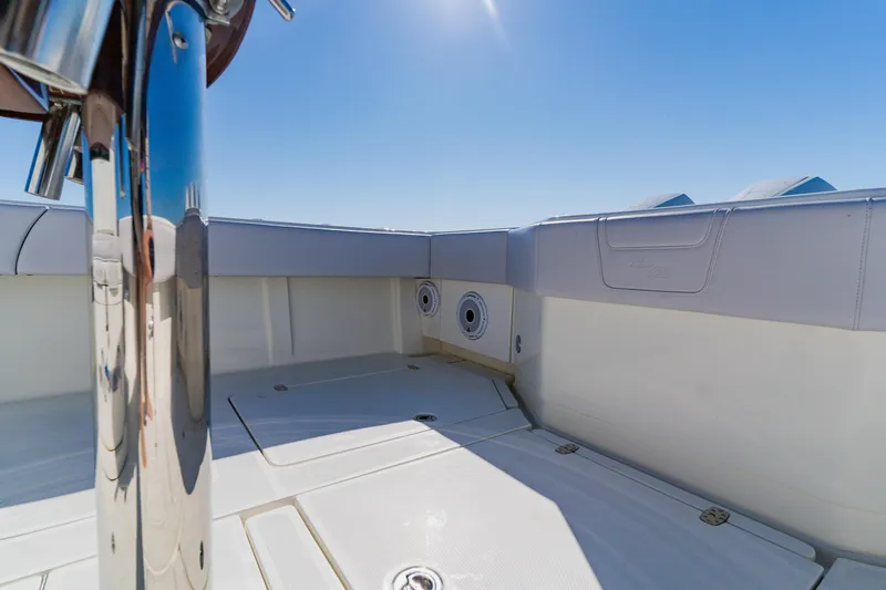 Slide: The Image of 2012 SeaVee 390B boat deck with polished metal and clear blue sky. - 38