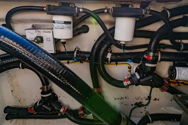 Slide: The Image of Engine compartment of 2012 SeaVee 390B boat, showing fuel filters and hoses. - 43