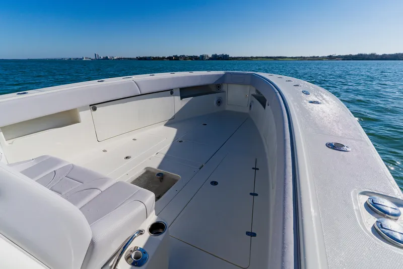 Slide: The Image of 2012 SeaVee 390B boat interior with spacious seating and ocean view. - 7
