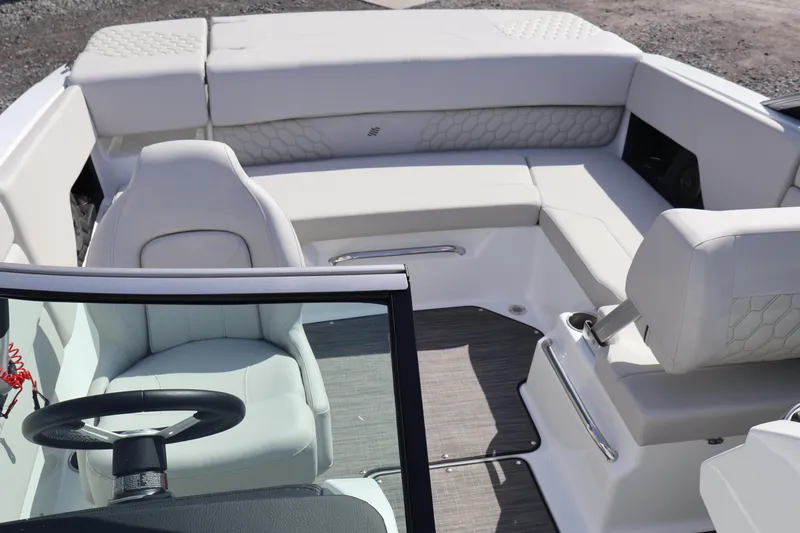 Slide: The Image of 2026 Four Winns H1 Freedom boat interior with luxurious seating and modern steering wheel. - 13