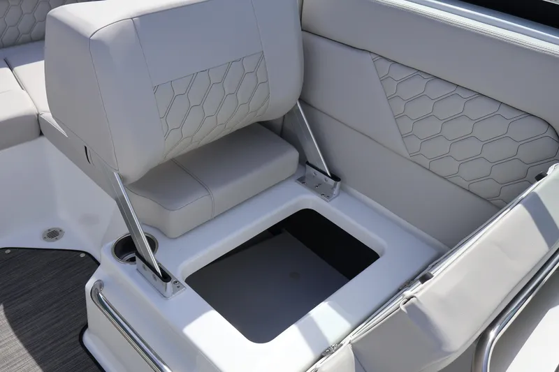 Slide: The Image of 2026 Four Winns H1 Freedom boat seat with storage compartment, featuring modern design and upholstery. - 15