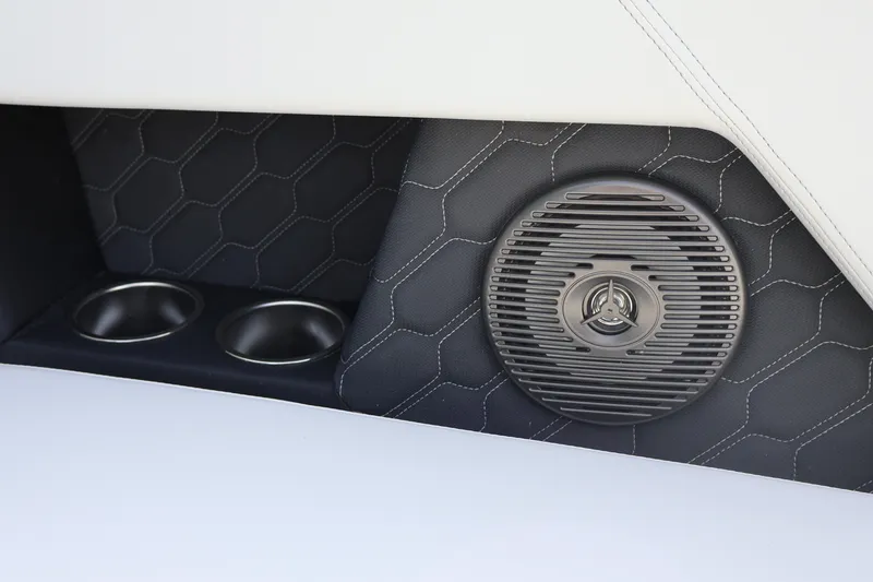Slide: The Image of 2026 Four Winns H1 Freedom interior with speaker and cup holders, featuring stylish stitching. - 16