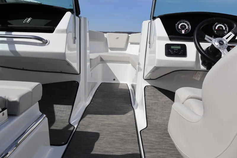 Slide: The Image of 2026 Four Winns H1 Freedom boat interior with modern dashboard and seating. - 17