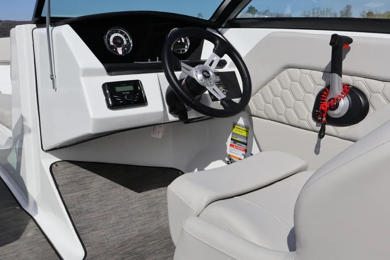 Slide: The Image of 2026 Four Winns H1 Freedom boat interior with steering wheel and control panel. - 19