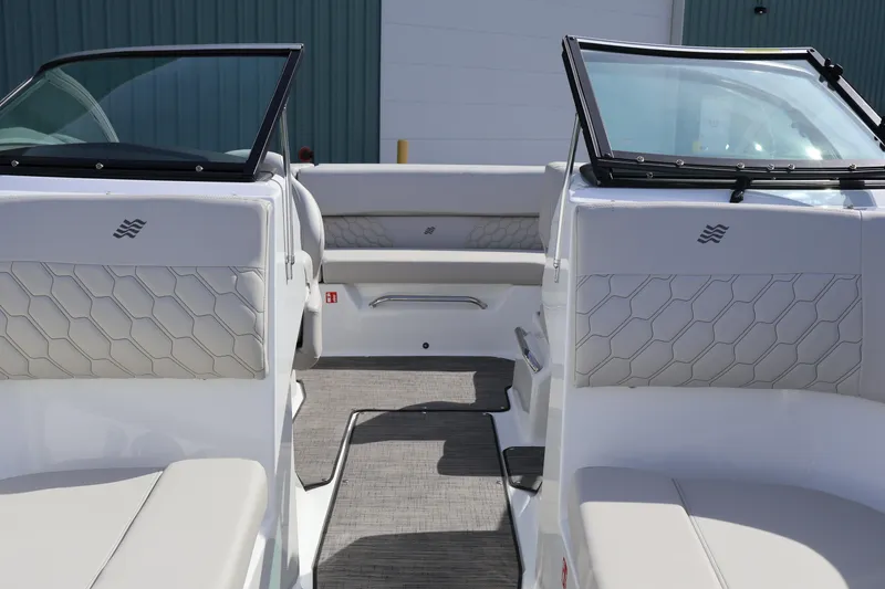 Slide: The Image of 2026 Four Winns H1 Freedom boat interior with modern seating and sleek design. - 21