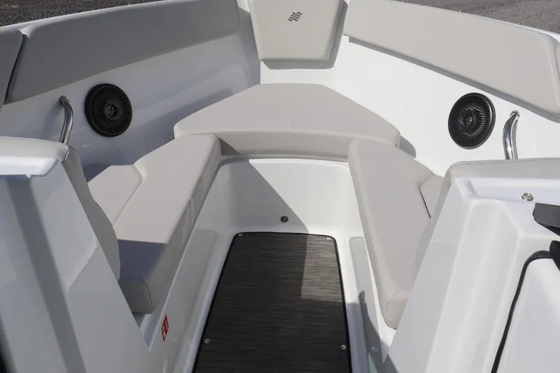 Slide: The Image of Interior seating of 2026 Four Winns H1 Freedom boat with speakers and cushions. - 23