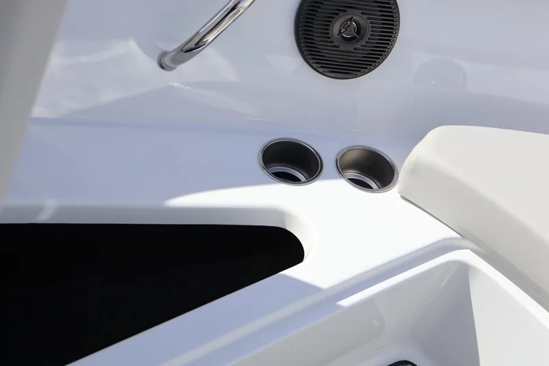 Slide: The Image of Interior detail of 2026 Four Winns H1 Freedom boat with cup holders and speaker. - 24