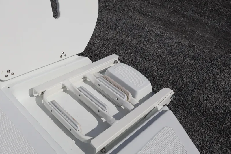 Slide: The Image of 2026 Four Winns H1 Freedom boat ladder on textured surface. - 6