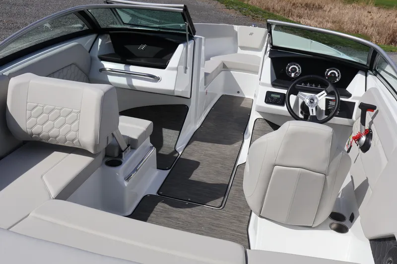 Slide: The Image of Interior of 2026 Four Winns H1 Freedom boat with modern seating and dashboard. - 7