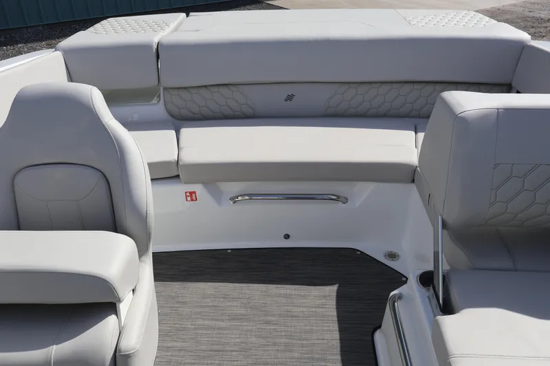 Slide: The Image of 2026 Four Winns H1 Freedom boat interior with sleek gray seating and modern design. - 8