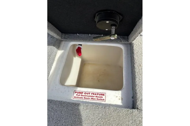 Slide: The Image of 2022 Nitro Z19 Sport boat compartment with pump-out feature and recirculator nozzle. - 14