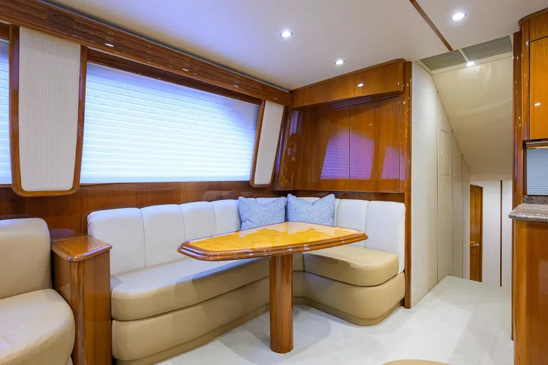 Slide: The Image of Luxurious interior of 2015 Viking 62 Convertible yacht with elegant seating and wooden finishes. - 16
