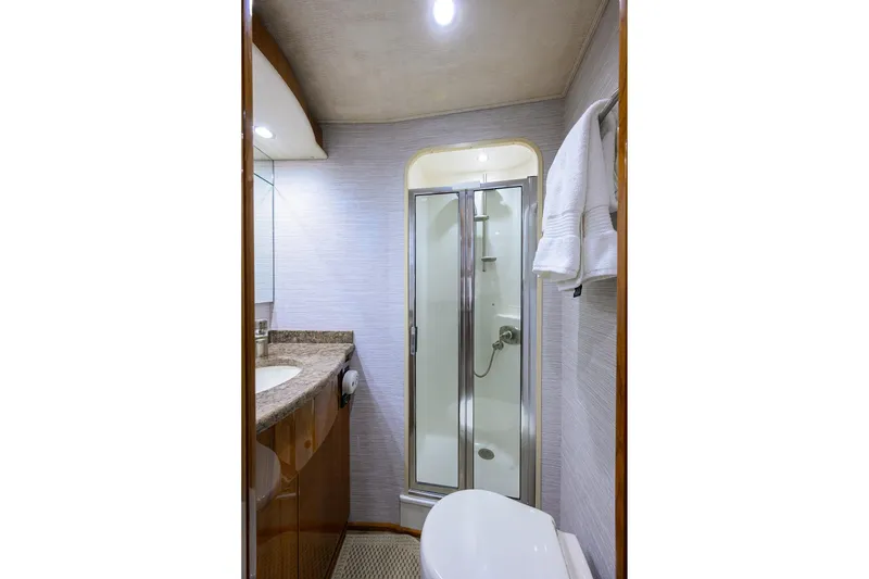 Slide: The Image of Luxurious bathroom in 2015 Viking 62 Convertible yacht with shower and elegant fixtures. - 24