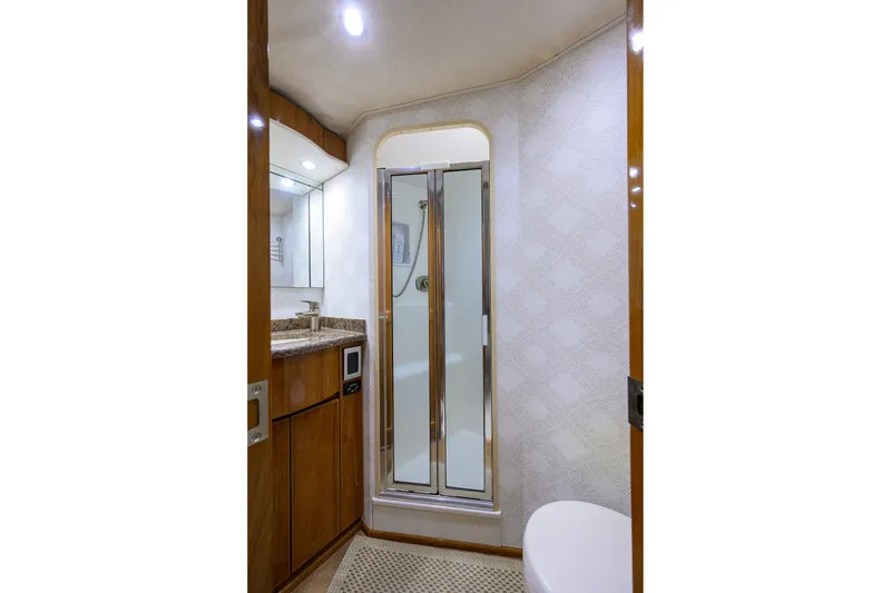 Slide: The Image of Luxurious bathroom in 2015 Viking 62 Convertible yacht with shower and vanity. - 35