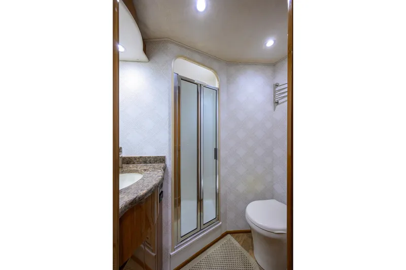 Slide: The Image of Luxurious bathroom in 2015 Viking 62 Convertible yacht with shower and modern fixtures. - 38