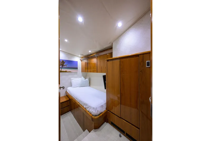 Slide: The Image of Luxurious cabin interior of 2015 Viking 62 Convertible yacht with wooden furnishings. - 51