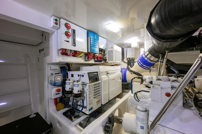 Slide: The Image of Engine room of 2015 Viking 62 Convertible yacht with Cummins Onan generator and control panels. - 59