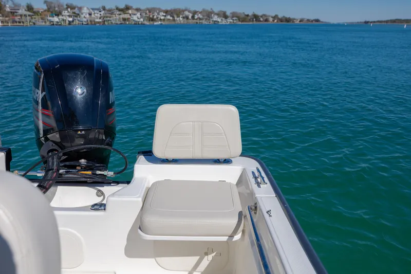 Slide: The Image of 2018 Boston Whaler 170 Montauk boat with Mercury engine on calm blue water. - 11
