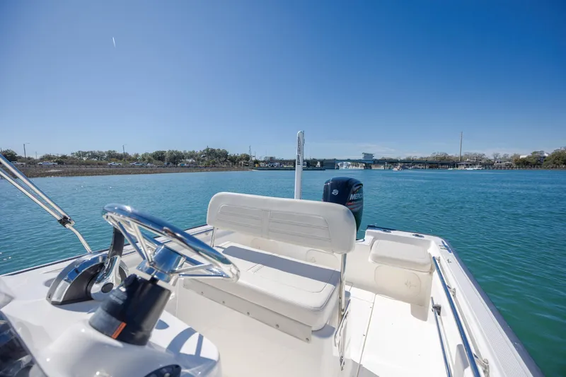 Slide: The Image of 2018 Boston Whaler 170 Montauk boat on calm blue water under clear sky. - 13