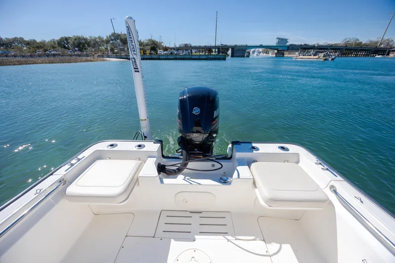 Slide: The Image of 2018 Boston Whaler 170 Montauk boat with outboard motor on calm water. - 9