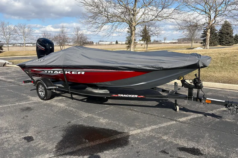Slide: The Image of 2021 Tracker Pro Team 175 TXW Tournament Edition boat with cover on trailer. - 3