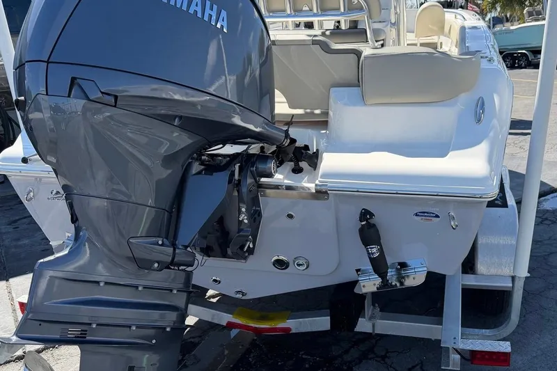Slide: The Image of 2026 Key West 203 FS boat with Yamaha outboard motor, rear view on trailer. - 10