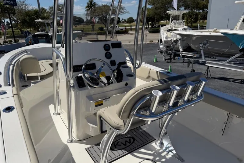 Slide: The Image of 2026 Key West 203 FS boat interior with steering console and seating. - 14