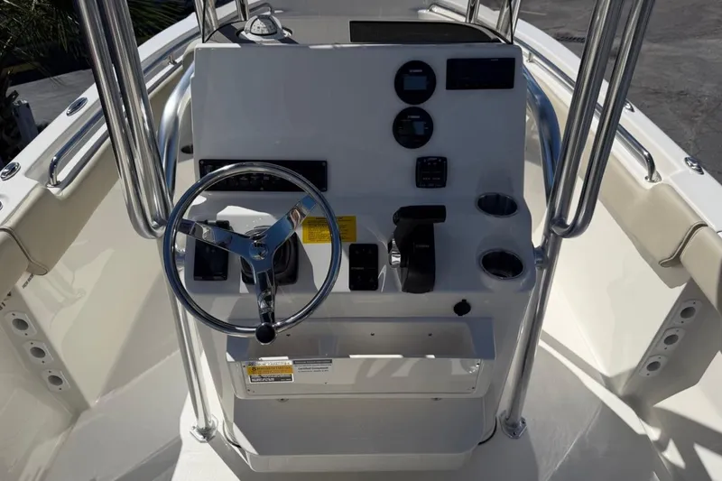 Slide: The Image of 2026 Key West 203 FS boat console with steering wheel and controls. - 15