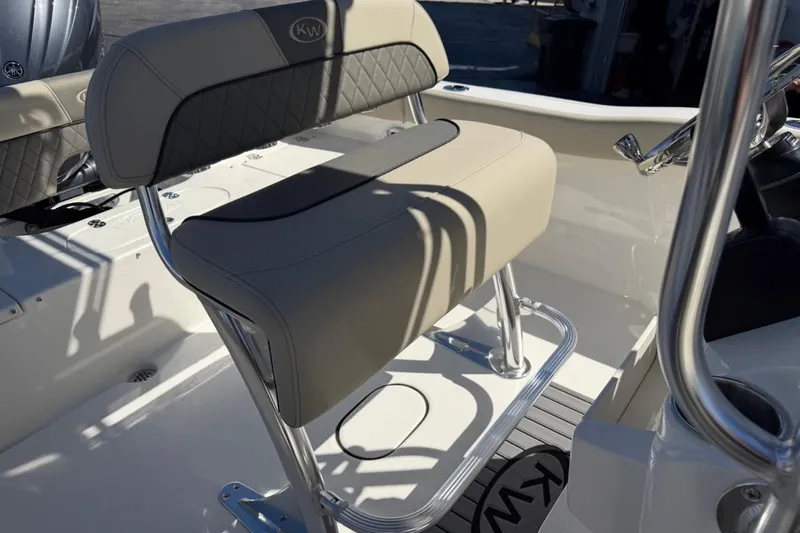Slide: The Image of 2026 Key West 203 FS boat interior with cushioned seating and stainless steel frame. - 16