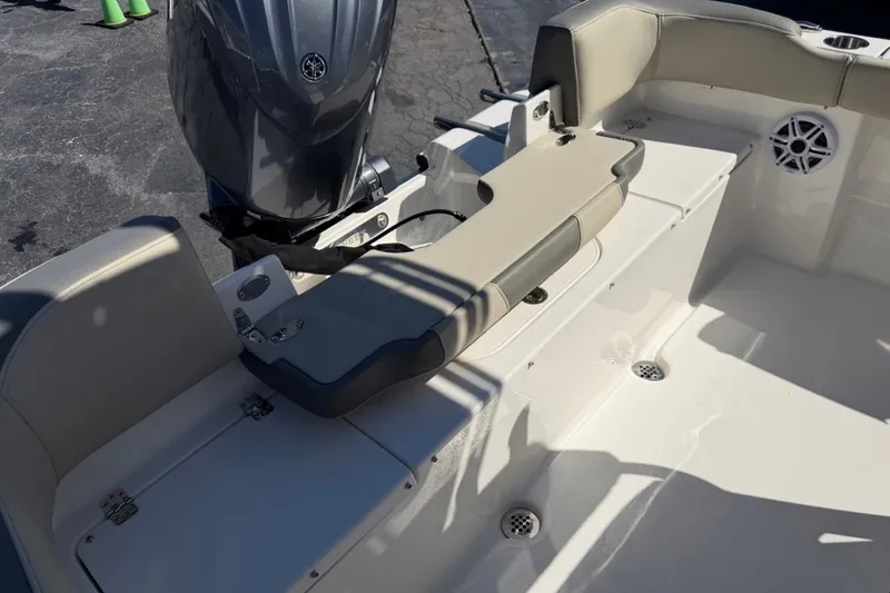 Slide: The Image of 2026 Key West 203 FS boat interior with motor and seating area. - 21