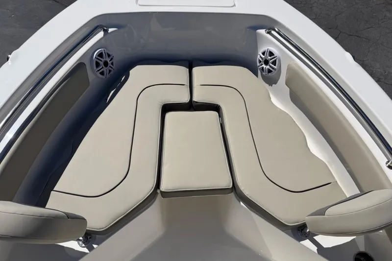 Slide: The Image of 2026 Key West 203 FS boat interior with cushioned seating and built-in speakers. - 22