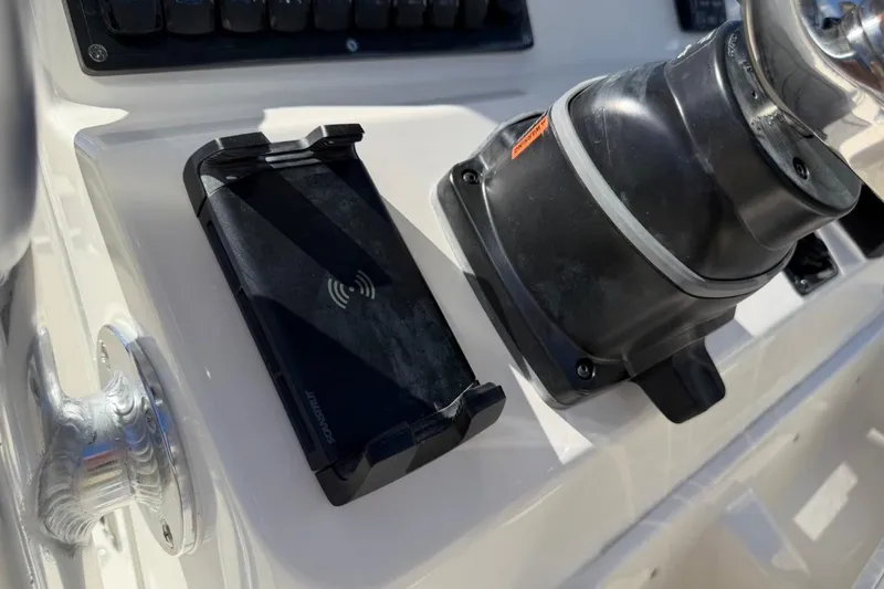 Slide: The Image of Control panel of 2026 Key West 203 FS boat with wireless charging pad. - 30