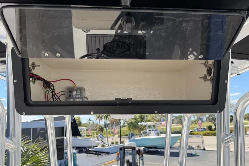 Slide: The Image of 2026 Key West 203 FS boat console storage with wiring and control panel. - 34