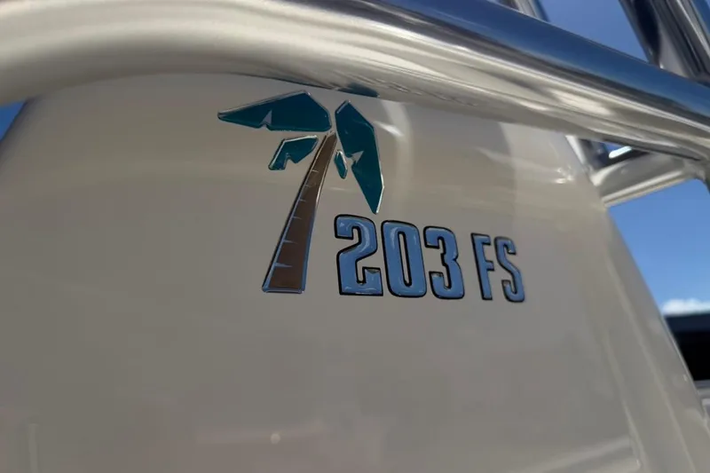 Slide: The Image of Key West 203 FS 2026 boat logo with palm tree design. - 45