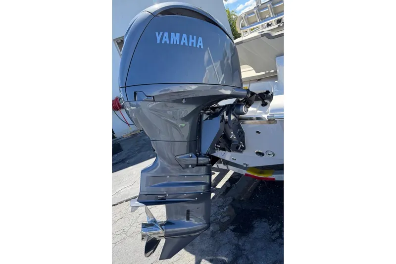 Slide: The Image of 2026 Key West 203 FS boat with Yamaha outboard motor, rear view. - 9