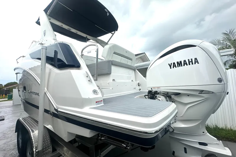Slide: The Image of 2025 Regal 26 XO boat with Yamaha engine, featuring sleek design and spacious deck. - 12