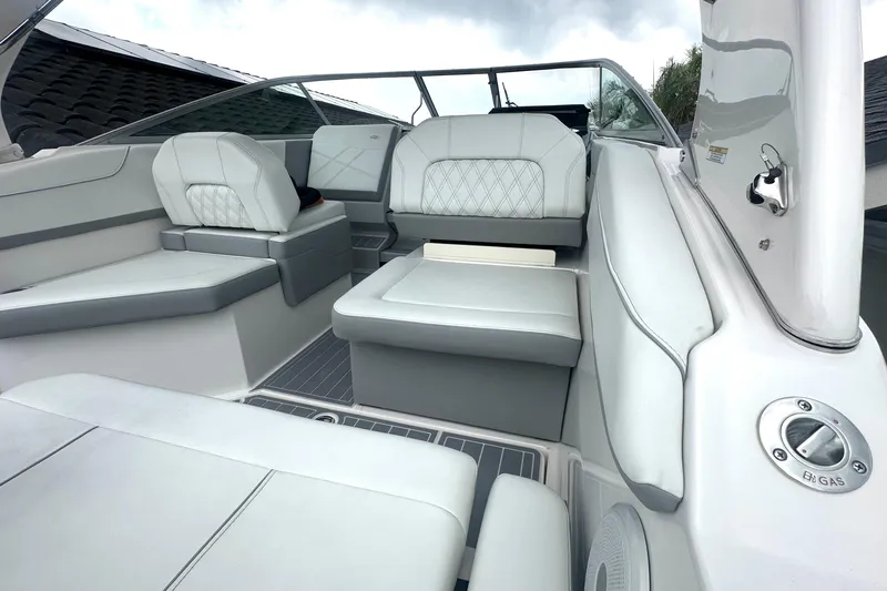 Slide: The Image of 2025 Regal 26 XO boat interior with luxurious white seating and modern design. - 16