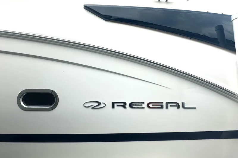 Slide: The Image of 2025 Regal 26 XO boat exterior with logo and sleek design. - 17